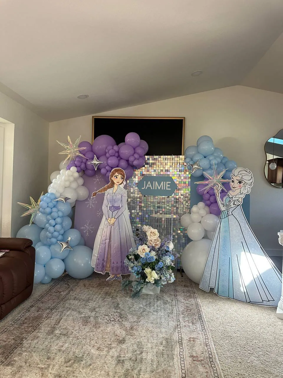 Pastel balloon arch with a princess backdrop