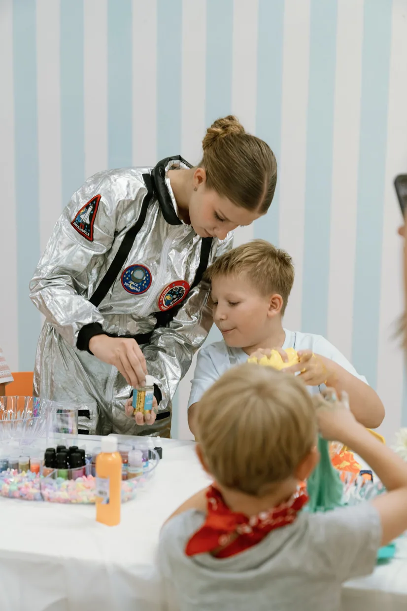 Children in astronaut costumes at a themed party