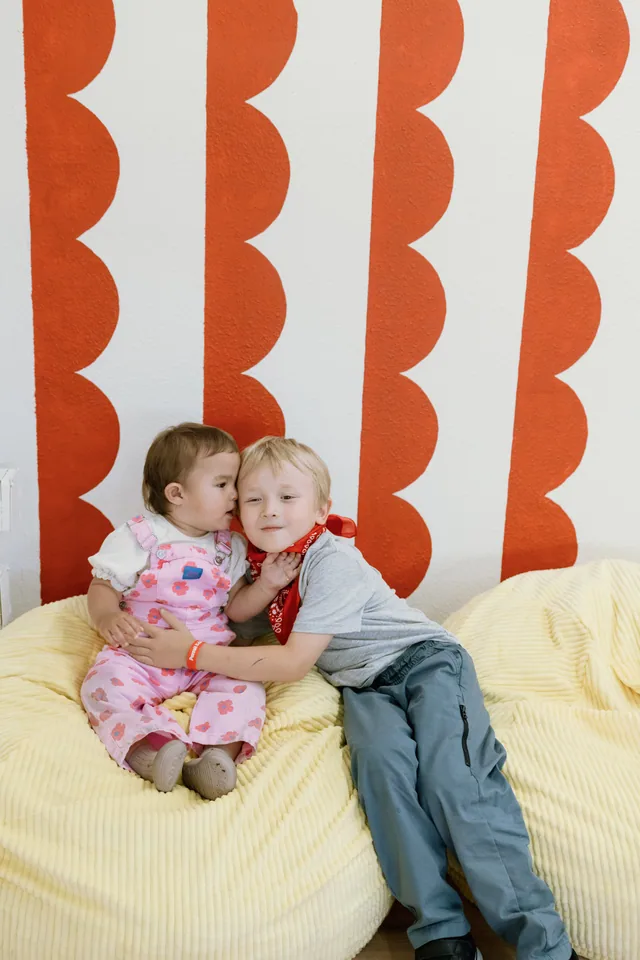 Two toddlers on soft yellow bean bags